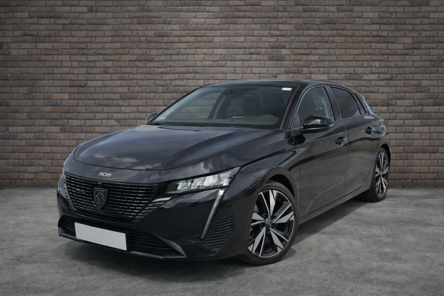 peugeot 308 contre mur en briques